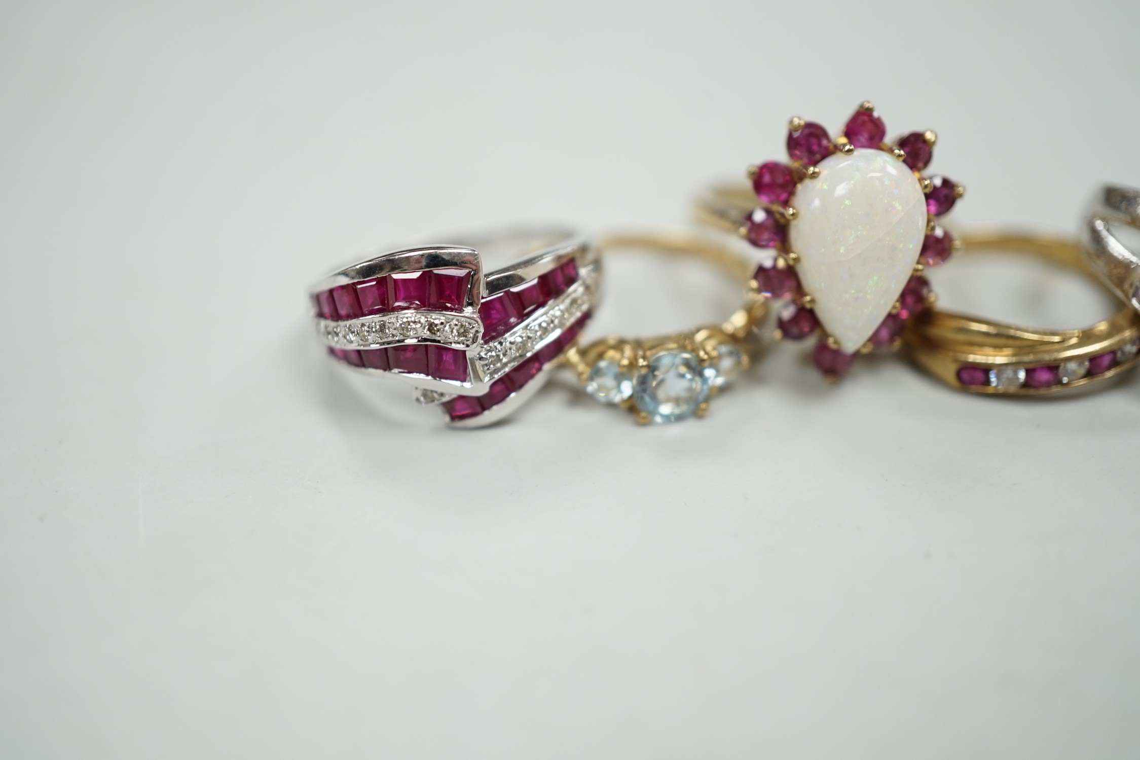 Five assorted modern 9ct gold and gem set dress rings, including ruby and diamond chip, gross weight 16.8 grams.